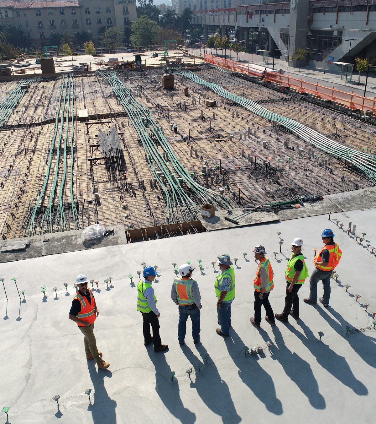 Engineers reviewing structural works at a construction site — Structarch Consultants