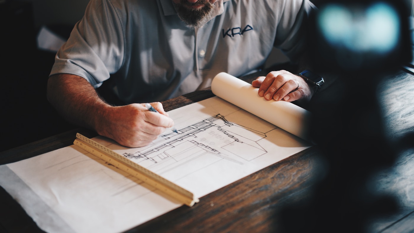 Structural blueprints and drafting tools on desk