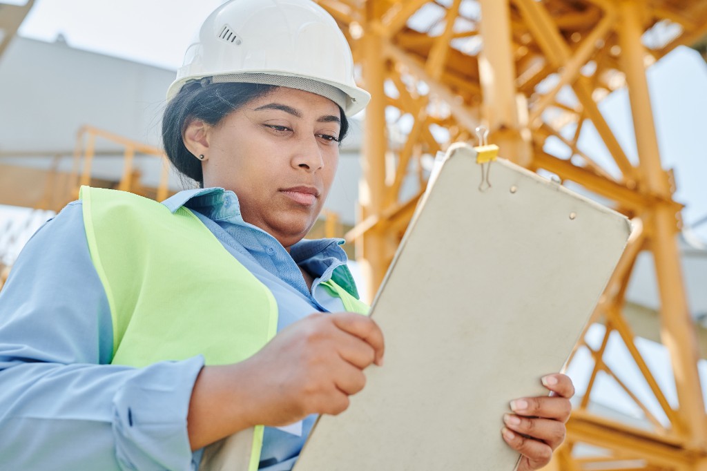 Engineer assessing existing structure for retrofit consultancy
